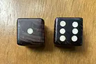 Two dice. The first with the 1 side up, the second with the 6 side up