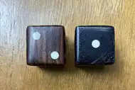Two dice. The first with the 2 side up, the second with the 1 side up