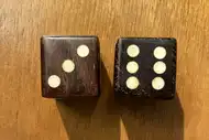 Two dice. The first with the 3 side up, the second with the 6 side up