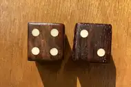 Two dice. The first with the 4 side up, the second with the 2 side up