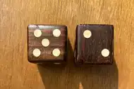 Two dice. The first with the 5 side up, the second with the 2 side up