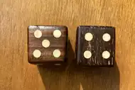 Two dice. The first with the 5 side up, the second with the 4 side up