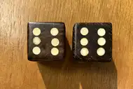 Two dice. The first with the 6 side up, the second with the 6 side up